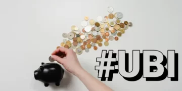 A pggy bank with coins laid out around it. Contains the hashtag u.b.i.