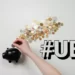 A pggy bank with coins laid out around it. Contains the hashtag u.b.i.