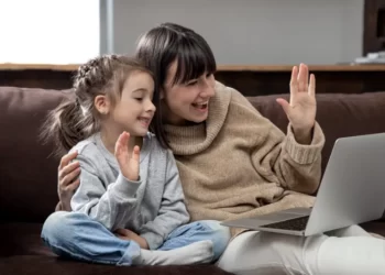 single mother with daughter both smiling