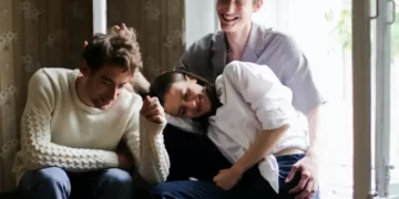 Two men and a woman in a polygamous relationship