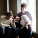 Two men and a woman in a polygamous relationship