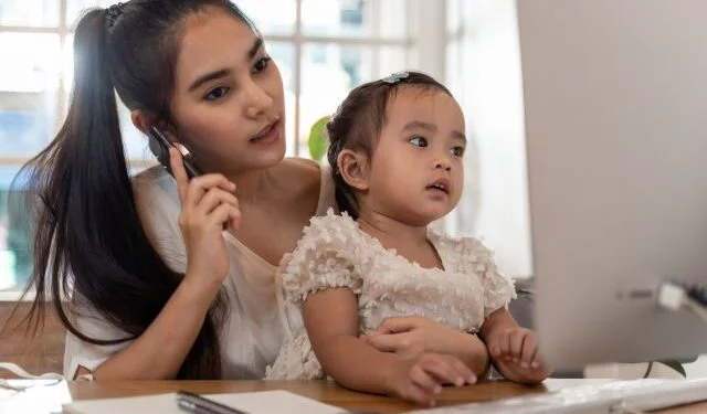 Mother and daughter using a computer and internet during mother working from home